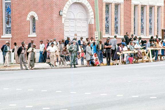 people along street