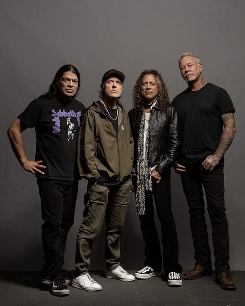 Metallica band members standing in group