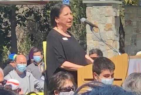 Judy Miner speaking to rally