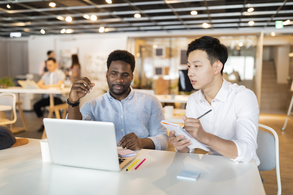 two young men at a computer